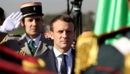 French President Emmanuel Macron reviews troops at Algiers Airport following his arrival in Algiers, Algeria, December 6, 2017. REUTERS/Ludovic Marin/Pool
