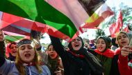 Pro-Palestinian protesters chant slogans and wave Palestinian flags during a demonstration against the US president's recognition of Jerusalem as Israel's capital in Istanbul on December 8, 2017. (AFP / YASIN AKGUL)
