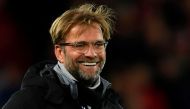 Liverpool's German manager Jurgen Klopp smiles on the pitch at the end of the UEFA Champions League Group E football match between Liverpool and Spartak Moscow at Anfield in Liverpool, north-west England on December 6, 2017. / AFP / Paul ELLIS
