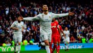 Real Madrid's Portuguese forward Cristiano Ronaldo celebrates after scoring a goal during the Spanish league football match between Real Madrid and Sevilla at the Santiago Bernabeu Stadium in Madrid on December 9, 2017. / AFP / PIERRE-PHILIPPE MARCOU
