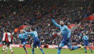 Arsenal's French striker Olivier Giroud celebrates scoring the team's first goal during the English Premier League football match between Southampton and Arsenal at St Mary's Stadium in Southampton, southern England on December 10, 2017.   AFP / Adrian DE