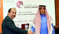 Ali bin Abdulatif Al Misnad (right), Board Member and Honorary Treasurer of QC; shake hands with Helmy Shebubakar, Vice-Chairman of Indonesian Chamber of Commerce,  during the Qatari-Indonesian Business Forum, at Qatar Chamber head quarters, yesterday.