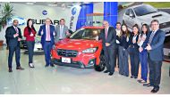 Staff and other officials with the revamped Subaru XV at Mannai Auto Group’s car showroom. 