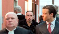 Bayern Munich's midfielder Franck Ribery (C) and his lawyer Carlo Brusa (front L) arrive at court over a case filed by his former agent Bruno Heiderscheid who is claiming 3.5 million euros from the French football star, on December 12, 2017 in the souther
