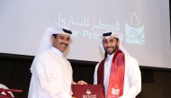 Saad Sherida Al Kaabi, President and CEO of Qatar Petroleum, honouring one of the graduates