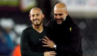 Manchester City manager Pep Guardiola celebrates with David Silva at the end of the match Action Images via Reuters/Andrew Boyers  
