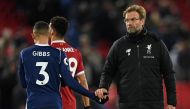 Liverpool's German manager Jurgen Klopp (R) shakes hands with West Bromwich Albion's English defender Kieran Gibbs (L) on the pitch after the English Premier League football match between Liverpool and West Bromwich Albion at Anfield in Liverpool, north w