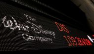 A logo of Walt Disney company is displayed on a monitor outside of the New York Stock Exchange shortly after the opening bell in New York, U.S., December 5, 2017. REUTERS/Lucas Jackson/File Photo
