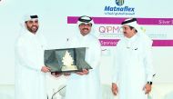 H E Dr Mohammed bin Saleh Al Sada (centre), Minister of Energy and Industry presenting a memento to Abdulaziz Al Khalifa (left), CEO of Qatar Development Bank, on the sidelines of ‘Made in Qatar’ expo, as Sheikh Khalifa bin Jassim Al Thani, Chairman of Qa