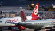 A grounded aircraft of bankrupt Niki Luftfahrt GmbH is pictured at the Vienna International Airport in Schwechat, Austria, on December 14, 2017.   AFP / ALEX HALADA
