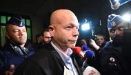 Belgian lawyer Sven Mary leaves Brussels' courthouse after a hearing regarding the postponement of the trial of his client, Paris attacks suspect Salah Abdeslam, on December 18, 2017. AFP / EMMANUEL DUNAND