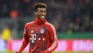 Bayern Munich's French defender Kingsley Coman smiles before the German football Cup DFB Pokal round of sixteen football match during the Bayern Munich vs Dortmund on December 20, 2017 in Munich.  AFP / Christof STACHE