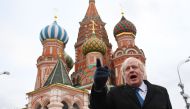 British Foreign Secretary Boris Johnson stands in front of Saint Basil's cathedral in Red square in Moscow on December 22, 2017 after a meeting with his Russian counterpart. (AFP / POOL / Stefan Rousseau)