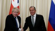 Britain's Secretary of State for Foreign and Commonwealth Affairs Boris Johnson (L) and Russian Foreign Minister Sergei Lavrov (R) shake hands during their joint press conference in Moscow, Russia, on December 22, 2017. ( Sefa Karacan - Anadolu Agency )