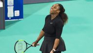 Serena Williams of the US reacts after losing a point to Jelena Ostapenko of Latvia during the Mubadala World Tennis Championship 2017 match in Abu Dhabi, on December 30, 2017. / AFP / NEZAR BALOUT