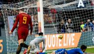 AS Roma's Bosnian forward Edin Dzeko (L) celebrates after scoring a goal later to be found invalid during the Italian Serie A football match AS Roma versus Sassuolo on December 30, 2017 at the Olympic stadium in Rome. / AFP / Vincenzo PINTO