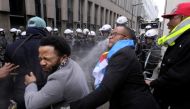 Members of Congolese associations calling Joseph Kabila to step down as President of the Democratic Republic of Congo, clash with police officers during a demonstration on December 30, 2017 in Brussels. Belgium OUT / AFP.