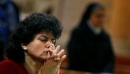 A woman prays during a New Year's Eve mass at Saint Joseph's Roman Catholic Church in Cairo, Egypt December 31, 2017. Reuters/Mohamed Abd El Ghany