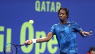 France's Gael Monfils returns the ball to Peter Gojowczyk during the quarter-final of the ATP Qatar Open tennis competition in Doha on January 4, 2018. AFP / Karim Jaafar
