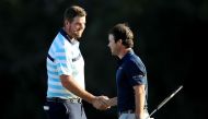 Marc Leishman of Australia and Brian Harman of the United States shake hands after finishing on the 18th green during the second round of the Sentry Tournament of Champions at Plantation Course at Kapalua Golf Club on January 5, 2018 in Lahaina, Hawaii. S