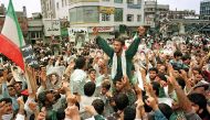 This file photo taken on July 14, 1999 shows Iranian demonstrators participating in a rally in support of the Islamic regime at Tehran University campus. / AFP / HENGHAMEH FAHIMI.
