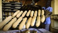A Sudanese man works at a bakery in the capital Khartoum on January 5, 2018.  AFP / ASHRAF SHAZLY
