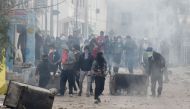 Tunisian protesters clash with security forces in the town of Tebourba on January 9, 2018, following the funeral of a man who was killed the previous day in a demonstration over rising costs and government austerity. AFP / Fethi Belaid