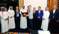Mohammed bin Ahmed bin Towar Al Kuwari, (fourth left) Vice Chairman of Qatar Chamber presenting a memento to Turkish delegation during the opening of Mobiliyum B2B forum at Marriott Marquis Doha yesterday.  PIC: Abdul Basit/ The Peninsula 

