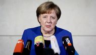 German Chancellor and Christian Democratic Union (CDU) leader Angela Merkel gives a statement as she arrives for talks with the leaders of the conservative CDU/CSU union and the social democratic SPD party on forming a new government on January 11, 2018 a