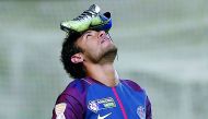 Paris Saint-Germain’s Neymar celebrates scoring their first goal from the penalty spot with his football boot on his head. Reuters/Benoit Tessier  