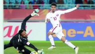Qatar’s Akram Afif (right) scores the winning goal againt Oman during the AFC U-23 Asian Cup Group A match played at the at the Changzhou Sports Centre, Changzhou, China yesterday.