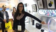 Monika Chalk of the Amazon Alexa team demonstrates an array of devices infused the company's artificial intelligence in a Roadshow trailer parked at the Consumer Electronics Show in Las Vegas, January 10, 2018. AFP / Glenn Chapman 