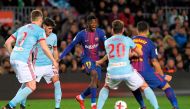 Barcelona's French forward Ousmane Dembele (C) vies with Celta Vigo's Spanish defender Sergi Gomez during the Spanish Copa del Rey (King's Cup) round of 16 second leg football match FC Barcelona vs RC Celta de Vigo at the Camp Nou stadium in Barcelona on 