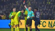 Nantes' Brazilian defender Diego Carlos (C) receives a red card from French referee Tony Chapron during the French L1 football match between Nantes and Paris Saint-Germain (Paris-SG) at the La Beaujoire stadium in Nantes, western France, on January 14, 20