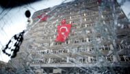The Ankara police headquarters is seen through a cars broken window caused by fighting during the coup attempt in Ankara, July 19, 2016. Reuters / Baz Ratner