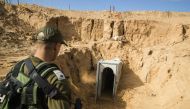 A picture taken 18 January 2018 from the Israeli side of the border with the Gaza Strip shows a Israeli army officer walking near the entrance of a tunnel, that Israel says was dug by the Islamic Jihad group, leading from the Palestinian enclave into Isra