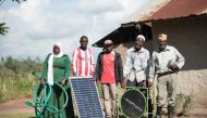 Ms.Madina Namutebi with her family ahead of work on their farm in Kyazanga, Uganda, on November 30, 2017. Handout: SolarNow / Lendahand Ethex