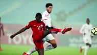 Qatari forward Almoez Ali kicks the ball during yesterday’s AFC U-23 Championship quarter-final match against Palestine in Changzhou, China.