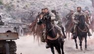 A still of actor Chris Hemsworth (C) from the movie 12 Strong.
