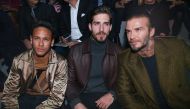 razilian soccer player Neymar Jr (L), German PSG's goalkeeper Kevin Trapp and British former soccer player David Beckham (R) attend the presentation of the Fall/Winter 2018/19 Men's collection by British designer Kim Jones for Louis Vuitton fashion house 