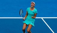 Elise Mertens of Belgium celebrates winning against Petra Martic of Croatia. REUTERS/David Gray