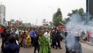 Riot policemen fire teargas canisters to disperse demonstrators during a protest organised by Catholic activists in Kinshasa, Democratic Republic of Congo January 21, 2018. REUTERS/Kenny Katombe
