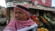 A Palestinian farmer seen at a market of the West Bank village of Qabatiya on February 8, 2016. (AFP / Jaafar Ashtiyeh) 
