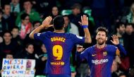 Barcelona's Argentinian forward Lionel Messi (R) celebrates with Barcelona's Uruguayan forward Luis Suarez after scoring a goal during the Spanish league football match between Real Betis and FC Barcelona at the Benito Villamarin stadium in Sevilla on Jan