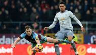 Manchester United's English defender Chris Smalling (R) vies with Burnley's English striker Ashley Barnes (L) during the English Premier League football match between Burnley and Manchester United at Turf Moor in Burnley, north west England on January 20,