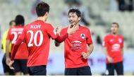 Al Rayyan  striker Rodrigo Tabata (right) celebrates with team-mate Koh after scoring a goal.