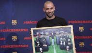 Javier Mascherano farewell ceremony - Auditorium 1899, Barcelona, Spain - January 24, 2018, Mascherano holds a picture during the ceremony. REUTERS/Albert Gea
