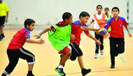 School students playing handball during an interschool match at the Schools Olympic Program (SOP) in Doha in this file picture.