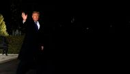US President Donald Trump waves as he walks out from the White House in Washington, US, as he departs to attend the 2018 World Economic Forum in Davos, Switzerland, January 24, 2018. REUTERS/Yuri Gripas
