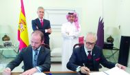 IIgnacio Escobar (left, standing), Spain’s ambassador to Qatar and Ahmed Rafea Al Emadi (right, standing), CEO of Al Koot Insurance and Reinsurance Company, look on as, Jehad Badreddin Rahima (right, sitting) Chief Officer Health and Life at Al Koot Insur